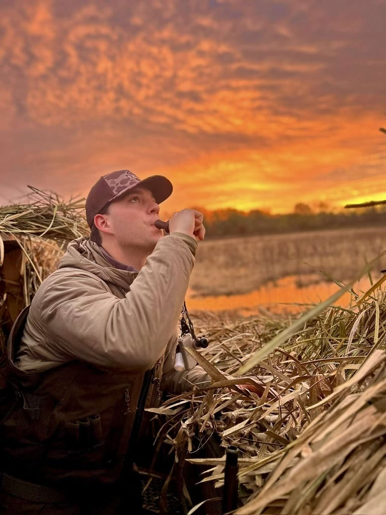 Duck Hunter Wearing Brown Camo Trucker Hat