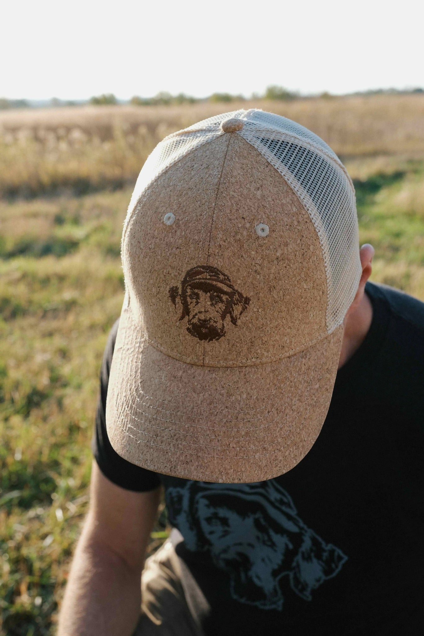 Unique Cork Hat With Dog Logo on Hunter in Field